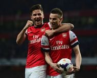 LONDON, ENGLAND - APRIL 28:  Laurent Koscielny of Arsenal celebrates wth Olivier Giroud (L) as he scores their first goal during the Barclays Premier League match between Arsenal and Newcastle United at Emirates Stadium on April 28, 2014 in London, England.  (Photo by Jamie McDonald/Getty Images)